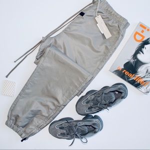 FEAR OF GOD ESSENTIALS ‘Desert Taupe’ Nylon Trackpants